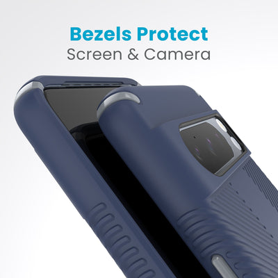 A case with phone inside with camera facing up is lying on top of a case with phone inside with screen facing up. Both are at a sharp angle clearly showing case's raised bezels around screen and camera. Text reads bezels protect screen and camera.#color_coastal-blue-dust-grey