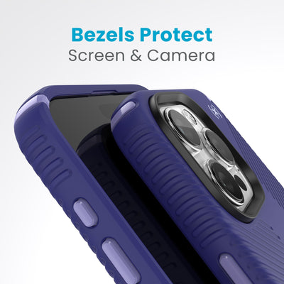 A case with phone inside with camera facing up is lying on top of a case with phone inside with screen facing up. Both are at a sharp angle clearly showing case's raised bezels around screen and camera. Text reads bezels protect screen and camera.#color_future-blue-purple-ink