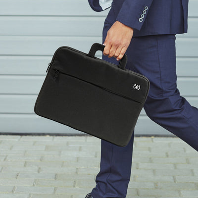 Close up of a sleeve being held by a man walking down the street#color_black