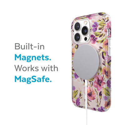 Three-quarter view of back of phone case with MagSafe charger attached - Built-in magnets. Works with MagSafe.#color_brushed-floral