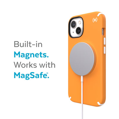 Three-quarter view of back of phone case with MagSafe charger attached - Built-in magnets. Works with MagSafe.#color_uplift-orange-white