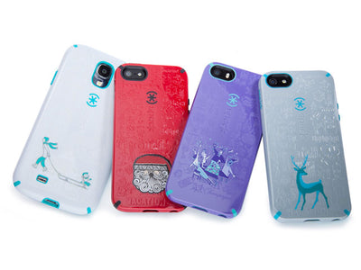 Lineup of four Holiday themed cases, one with man pulling child on sled, one with Santa Clause, one with New Years party, one with deer