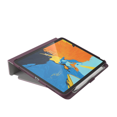 Three-quarter view of the front of the case, using typing stand formation.#color_plumberry-purple-crushed-purple-crepe-pink