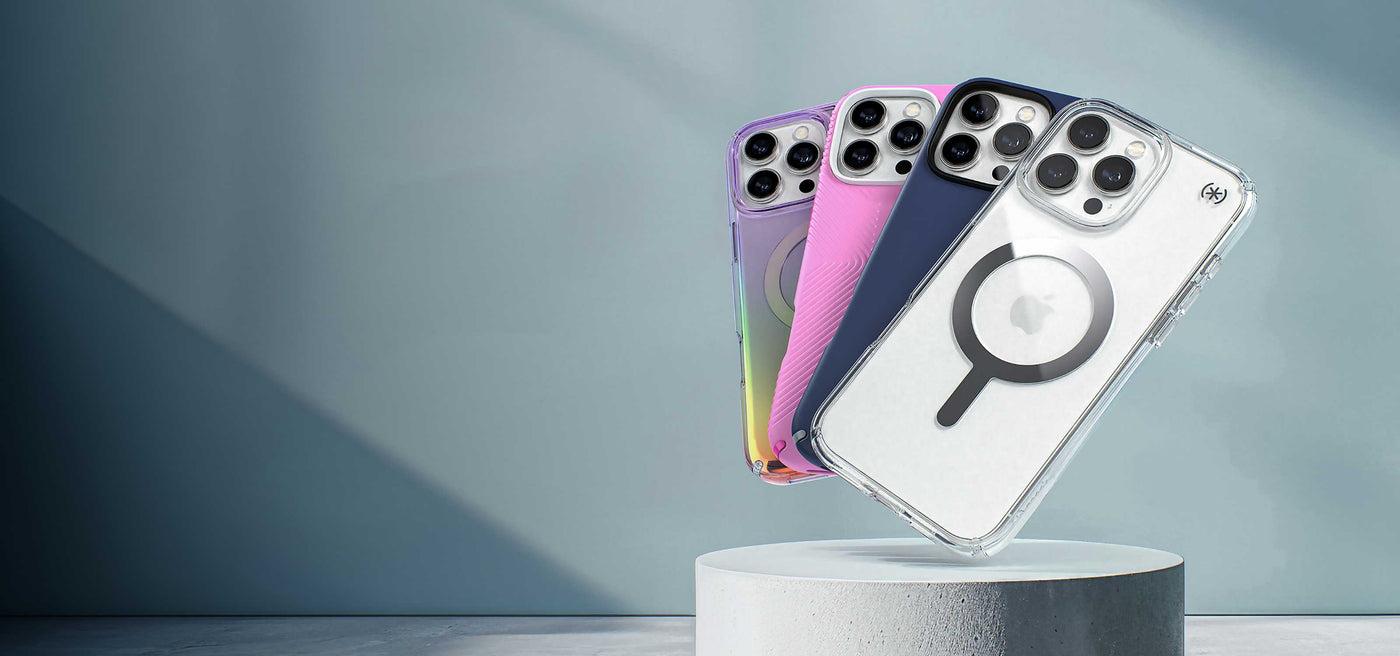 iPhone 16 phones are in various colors and designs of Speck cases and fanned out over a white pedestal