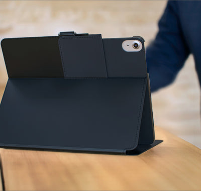 An iPad in a Balance Folio case sits on a table in view stand formation.