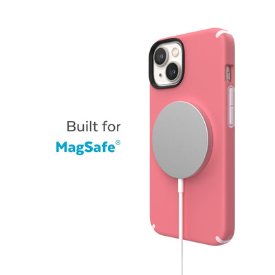 Three-quarter view of back of phone case with MagSafe charger attached - Built for MagSafe.#color_sweet-coral-light-coral