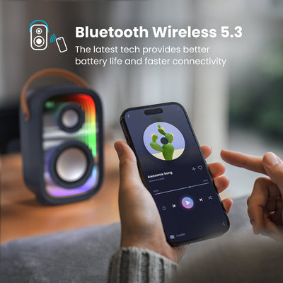 A person controls a music app on a smartphone in front of a Gemtones Infinity speaker. Bluetooth wireless 5.3 - the latest tech provides better battery life and faster connectivity#color_dark-grey-chrome-tan