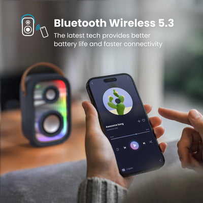 A person controls a music app on a smartphone in front of a Gemtones Infinity speaker. Bluetooth wireless 5.3 - the latest tech provides better battery life and faster connectivity#color_dark-grey-chrome-tan