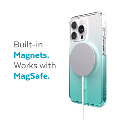 Three-quarter view of back of phone case with MagSafe charger attached - Built-in magnets. Works with MagSafe.#color_clear-fantasy-teal-fade