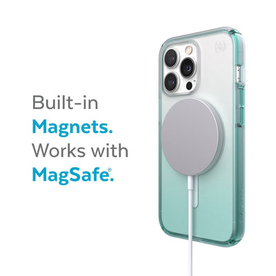 Three-quarter view of back of phone case with MagSafe charger attached - Built-in magnets. Works with MagSafe.#color_clear-arctic-teal-fade