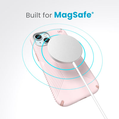 A case with phone inside with camera facing up and MagSafe wireless charger hovering above with concentric circles eminating from charger to signify power transfer. Text in image reads built for MagSafe.#color_nimbus-pink-dahlia-pink