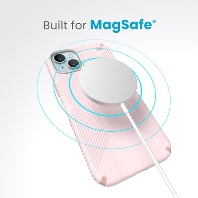 A case with phone inside with camera facing up and MagSafe wireless charger hovering above with concentric circles eminating from charger to signify power transfer. Text in image reads built for MagSafe.#color_nimbus-pink-dahlia-pink