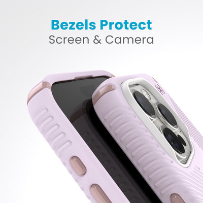 A case with phone inside with camera facing up is lying on top of a case with phone inside with screen facing up. Both are at a sharp angle clearly showing case's raised bezels around screen and camera. Text reads bezels protect screen and camera.#color_soft-lilac-carnation-petal