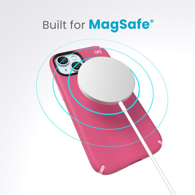A case with phone inside with camera facing up and MagSafe wireless charger hovering above with concentric circles eminating from charger to signify power transfer. Text in image reads built for MagSafe.#color_digital-pink-blossom-pink