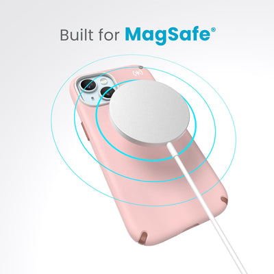 A case with phone inside with camera facing up and MagSafe wireless charger hovering above with concentric circles eminating from charger to signify power transfer. Text in image reads built for MagSafe.#color_dahlia-pink-rose-copper