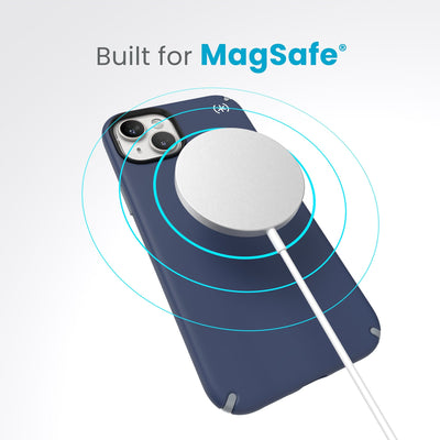 A case with phone inside with camera facing up and MagSafe wireless charger hovering above with concentric circles eminating from charger to signify power transfer. Text in image reads built for MagSafe.#color_coastal-blue-dust-grey