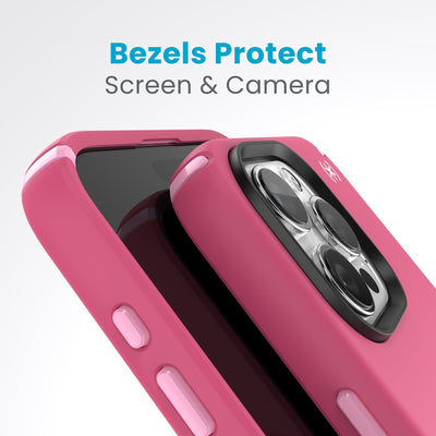 A case with phone inside with camera facing up is lying on top of a case with phone inside with screen facing up. Both are at a sharp angle clearly showing case's raised bezels around screen and camera. Text reads bezels protect screen and camera.#color_digital-pink-blossom-pink