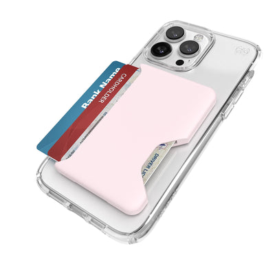 Three-quarter angled view of Wallet for MagSafe with ClickLock attached to an iPhone with a clear case on it - three cards are splayed out of the wallet.#color_nimbus-pink-pale-violet
