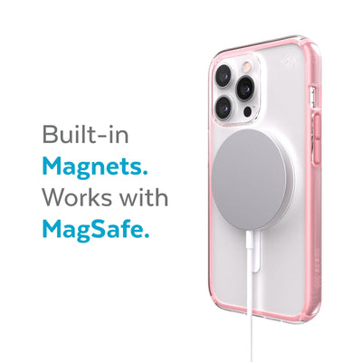 Three-quarter view of back of phone case with MagSafe charger attached - Built-in magnets. Works with MagSafe.#color_clear-rosy-pink