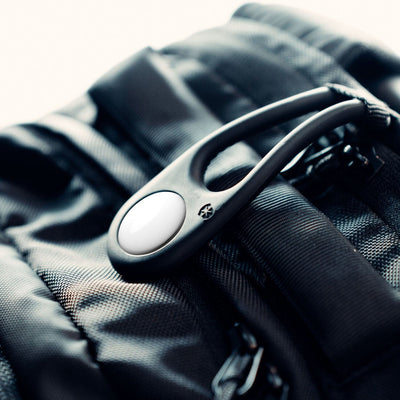 Close-up of a backpack with a SiliLoop attached to a strap